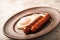 Close-up of sausages and fried eggs. Sausages on a plate and place for text. Breakfast fried eggs and bavarian sausages on a clay