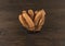 Close-up sausages with metal basket on wooden background. V