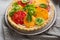 Close up of savory pie with cheese and tomatoes slice quiche