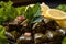 Close-up of savory stuffed grape leaves filled with a mouthwatering mixture of rice, onions,