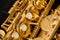 Close up saxophone fragment, musical instruments background