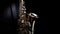 Close up of Saxophone, jazz music. Alto sax musical instrument on black background