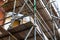 a close up of scaffolding poles on a building site using selective focus