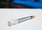 Close up scale of tuberculin syringe on white background.