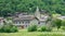 CLOSE UP: Scenic view of old medieval stone buildings in the French countryside.