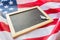 Close up of school blackboard on american flag