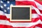 Close up of school blackboard on american flag