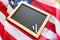 Close up of school blackboard on american flag