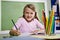 Close-up of school girl writing in notebook