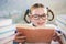 Close-up of schoolkid reading book in classroom