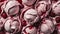 Close-up of scoops of raspberry ice cream with raspberry sauce