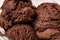 Close up of scoops of tasty chocolate ice cream isolated over light background