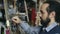 Close-up of Sculptor creating sculpture of woman`s face on canvas in art studio