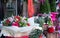 Close up of seasonal potted plants and flowers on sale at florist shop in December. Photographed pre-Christmas in Surrey, UK.