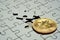 Close up a select focus gold bitcoin and Final piece of jigsaw puzzle.