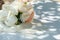 Close-up, selected focus. Wedding bouquet of beautiful brides arranged with roses, gypsophila and a variety of ornamental plants.