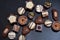 Close up of a selection of luxury chocolates, with a variety of shapes including a heart, florentines, and pistachios.