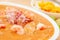 Close up of selective focus of Ecuadorian food: shrimp cebiche with some blurred chifles background