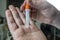 Close up, selective focus of a man taking a Covid 19 swab test at home