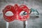 Close up, Selective focus on red venetian masquerade, carnival mask with blurry green mask background