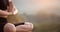 Close up with selective focus of yogi fit young woman practicing yoga exercises, breathing, meditating, Lotus pose