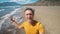 close up selfie portrait of happy middle aged greyhead man at sea coast enjoys sunny day on beautiful sandy beach Iztuzu