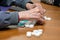 Close up of a senior man playing bingo at Nursing home. leisure game, support, assisted living, and retirement.