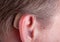 Close-up of a senior man& x27;s ear wearing hearing aid