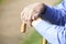 Close Up Of Senior Man\'s Hands Resting On Walking Stick