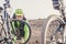 Close up of senior and mature man fixing and adjust the bike alone in mountain to go ride bike - cyclis with broke biciclet and