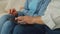 Close-up of senior people's hands networking online on digital tablet indoors