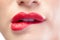 Close up on sensual model biting red lips