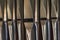 Close up of a series of standing organ pipes made of lead sheet