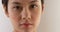 Close up of serious Asian woman\'s face