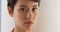 Close up of serious Asian woman\'s face