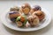 Close up of seven easter eggs on a white plate. The concept of Orthodox Easter.