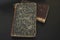 Close-up of several ancient books on a dark background. Matthew Gospel Bible 1871