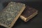 Close-up of several ancient books on a dark background. Matthew Gospel Bible 1871