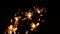 Close up several firework sparklers over black
