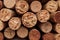 a close up of several wine corks stacked together in a pile with one cork missing the top of the cork