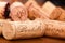 Close-Up of several Wine Corks on wood.