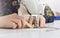 Close up of sewing machine and female hands dressmaker