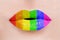 Close up of sexy caucasian woman perfect lips with rainbow lipstick. LGBT, lesbian love and pride concept