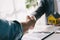 Close up shake hands, Considering buying a home, investing in real estate. Broker signs a sales agreement. agent, lease agreement