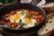 Close-up of Shakshuka with Runny Yolk and Crusty Bread