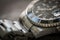 Close-up, shallow focus of a luxury, Swiss manufactured men`s mechanical diving watch.