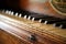 Close up shallow focus shot of a vintage piano or harpsichord keyboard, made of ebony, ivory and hardwood