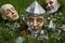 close-up of shattered garden gnomes face on grass