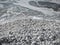 Close up of shingle or rocky or pebble beach with smooth and round white sea stones