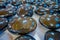 Close up of shinny natural mineral stone - black obsidian gemstone from Mexico over a table inside of a souvenir store